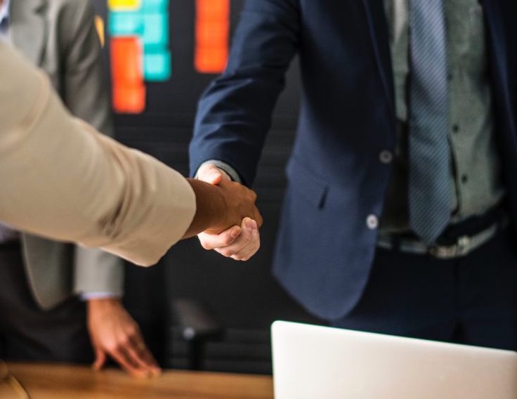 People shaking hands in business deal